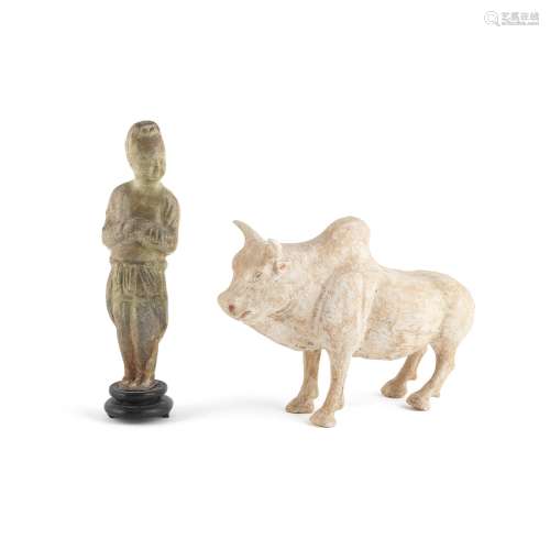 A STRAW-GLAZED FIGURE AND A POTTERY MODEL OF AN OX
