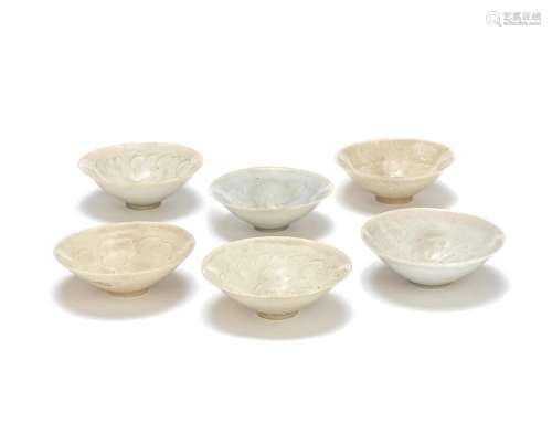 A GROUP OF SIX CARVED QINGBAI BOWLS
