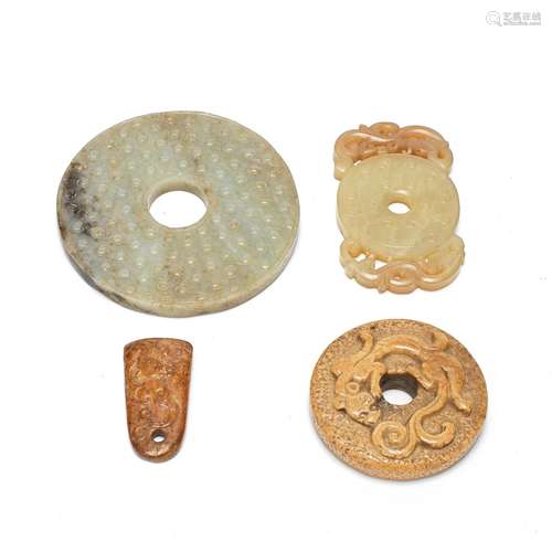 FOUR ARCHAISTIC JADE CARVINGS, THREE BI DISCS AND AN AXE PEN...