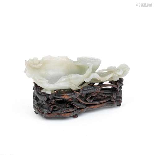 A JADE 'LOTUS' BRUSH WASHER AND WOOD STAND