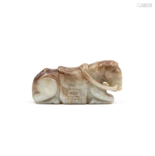 A PALE GREEN AND RUSSET JADE CARVING OF A RECUMBENT HORSE