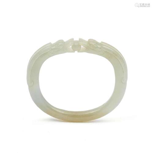 A PALE GREEN JADE 'DOUBLE DRAGON' BANGLE