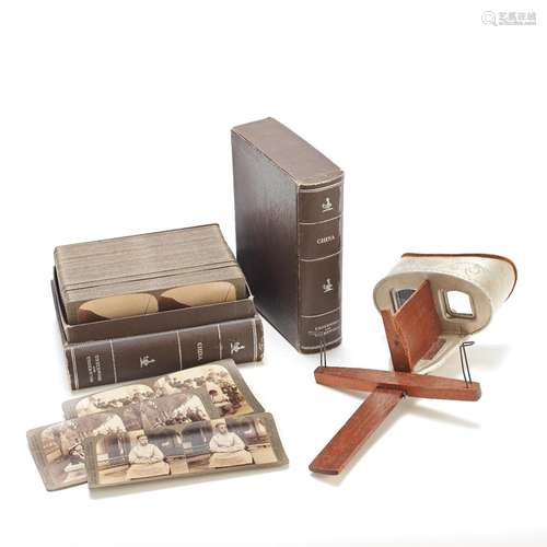 AN UNDERWOOD & UNDERWOOD STEREOSCOPIC VIEWER AND CASED-CARDS...