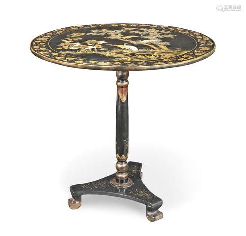 A GILT AND BLACK LACQUER TILT-TOP TABLE