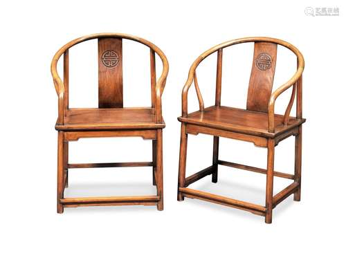 A PAIR OF HONGMU AND HUANGHUALI HORSESHOE-BACK ARMCHAIRS, QU...