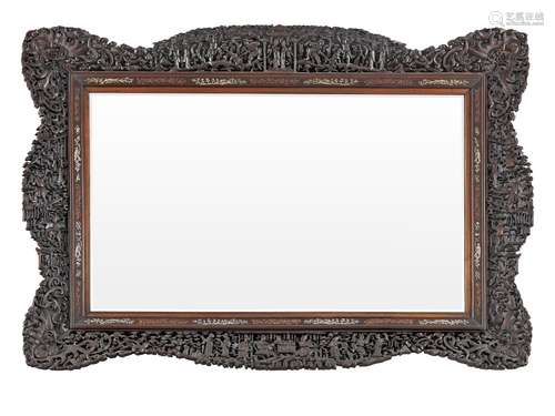 A LARGE CARVED HARDWOOD 'CANTON' MIRROR