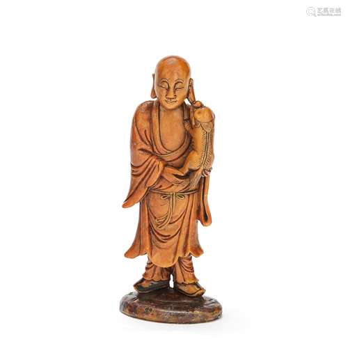 A SOAPSTONE FIGURE OF A MONK