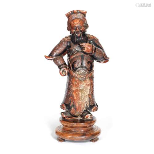 A SOAPSTONE FIGURE OF GUANDI