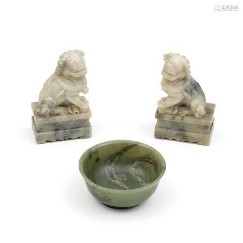 A SPINACH GREEN JADE BOWL AND A PAIR OF 'BUDDHIST LION' CARV...