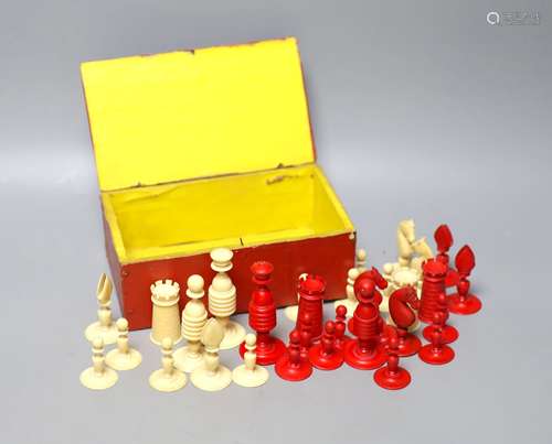 A 19th century red stained and natural ivory chess set, King...