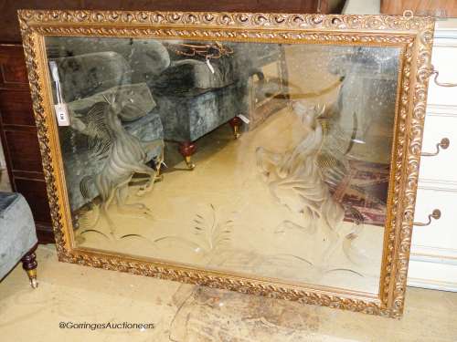 A rectangular gilt wall mirror etched with a stallion, width...