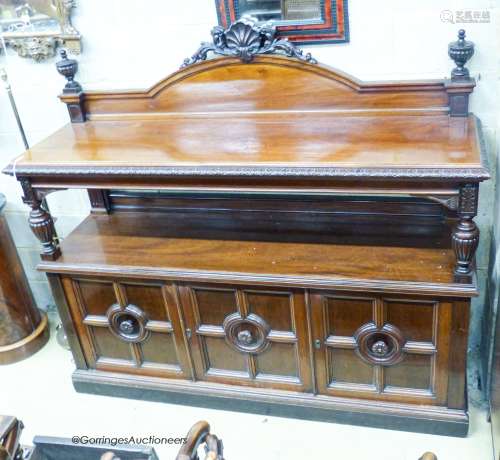 A Victorian Maple & Co. carved mahogany two tier buffet, len...