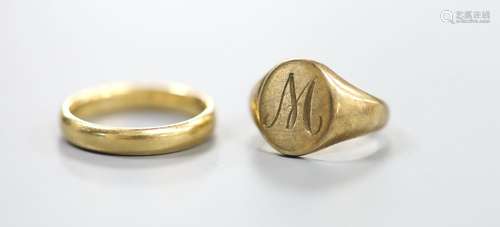 A 9ct gold signet ring, size E, 4.4 grams and an 18ct weddin...