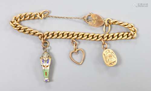 An Edwardian 15ct gold, curb link charm bracelets, hung with...