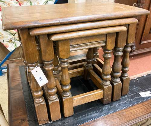 A nest of three reproduction rectangular oak tea tables, lar...