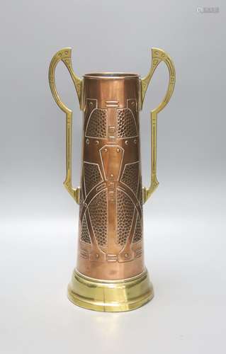 A Secessionist style copper and brass two handled cup, 40cm