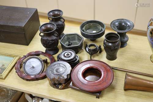 A group of Japanese bronze vases and sundry hardwood stands