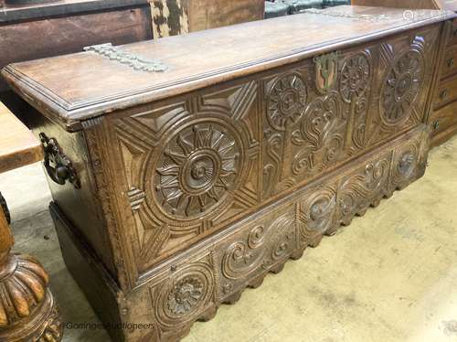 A 17th / 18th century Welsh oak coffer, with carved panelled...