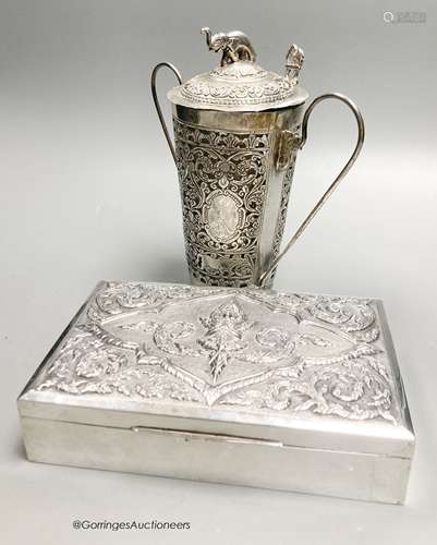 A Thai white metal rectangular cigarette box with embossed l...