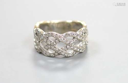 A modern 14k white metal and diamond chip set interwoven dre...