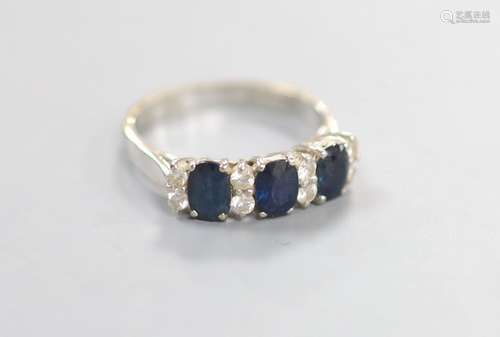 A modern 18ct white gold and three stone sapphire set half h...