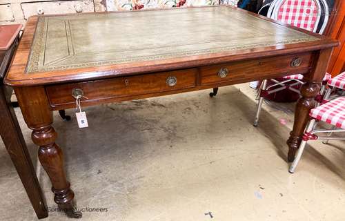 A Victorian mahogany partner's writing table, with green lea...