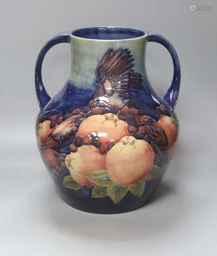 A large Moorcroft finches and fruit two handled vase, height...