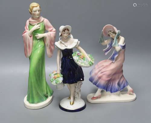 A Royal Dux figurine of a flower girl, height 26cm and two o...