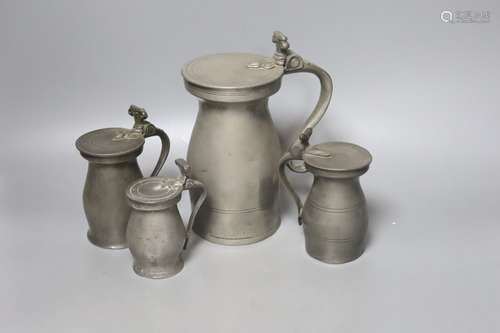 Four 18th century pewter baluster measures, tallest 20cm