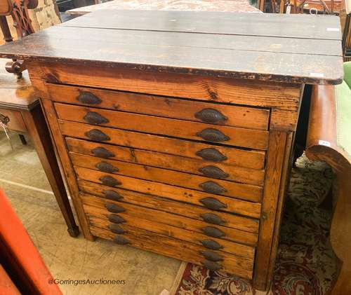 A late Victorian pine eleven drawer plan chest, W.118cm D.74...