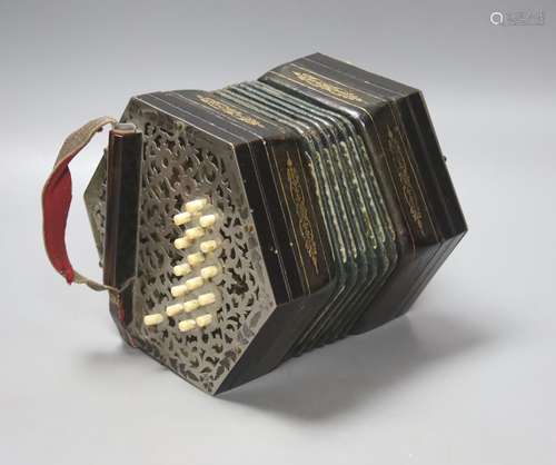 A Victorian 36 button concertina, with pierced nickel mounts...