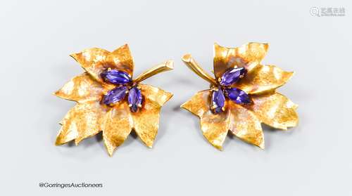 A pair of 750 yellow metal and three stone amethyst set leaf...