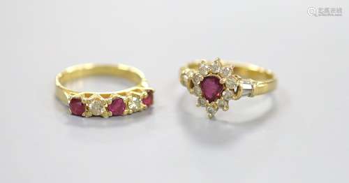 Two modern 18k, ruby and diamond dress rings, including pear...