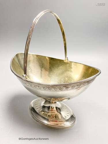 A George III silver boat shaped pedestal sugar basket, James...