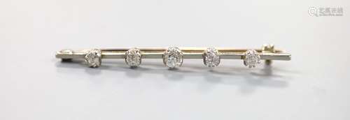 A yellow metal and graduated five stone diamond set bar broo...