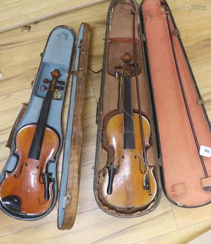 A Stradivarius copy violin and two bows and another bow, bot...