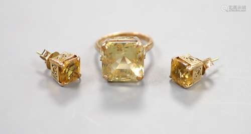 A yellow metal and citrine set dress ring, size K and a pair...