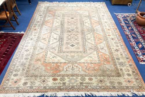 A large Caucasian Turkish design fawn ground carpet, 420 x 3...