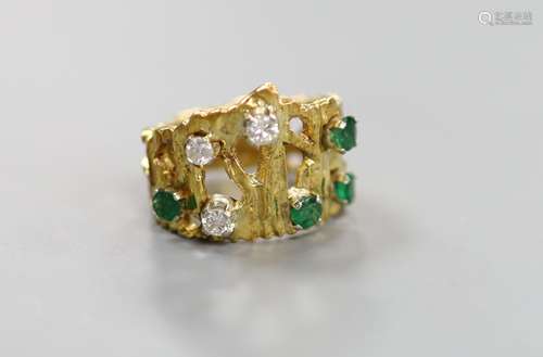 A pierced and textured 18ct, emerald and diamond set dress r...