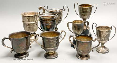 Eight assorted small silver trophy cups and one plated cup, ...