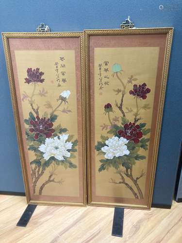 A pair of Chinese fabric panels decorated with chrysanthemum...