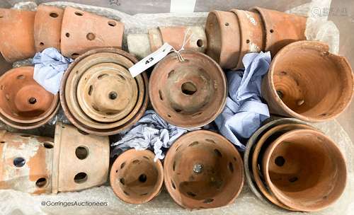 Approximately twenty six terracotta orchid pots, some stampe...