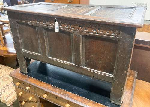 A 17th century caved panelled oak coffer, W.110cm D.48cm H.6...