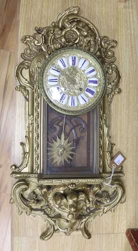 A 19th century French gilt and composition wall clock, with ...