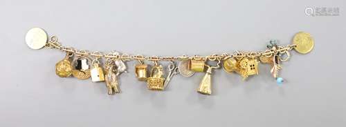 A 9ct charm bracelet, hung with assorted charms, gross weigh...