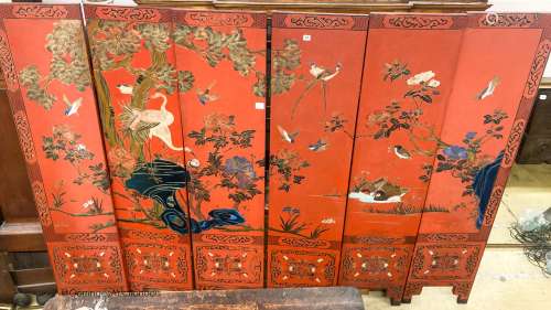 A Chinese red lacquered six fold screen, each panel W.41cm H...