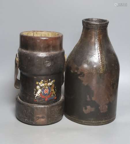 An 18th century leather bottle or blackjack and a WWII leath...