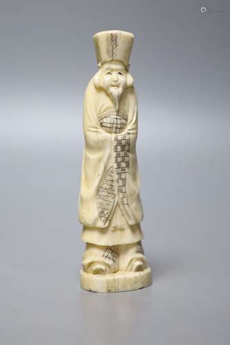 A Japanese walrus ivory figure of an immortal, early 20th ce...