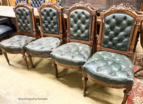 A set of twelve Victorian carved oak buttoned back and seat ...