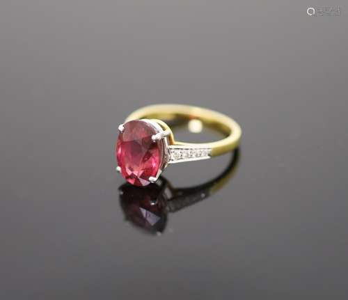 A modern 18ct gold and oval deep pink tourmaline ring, with ...